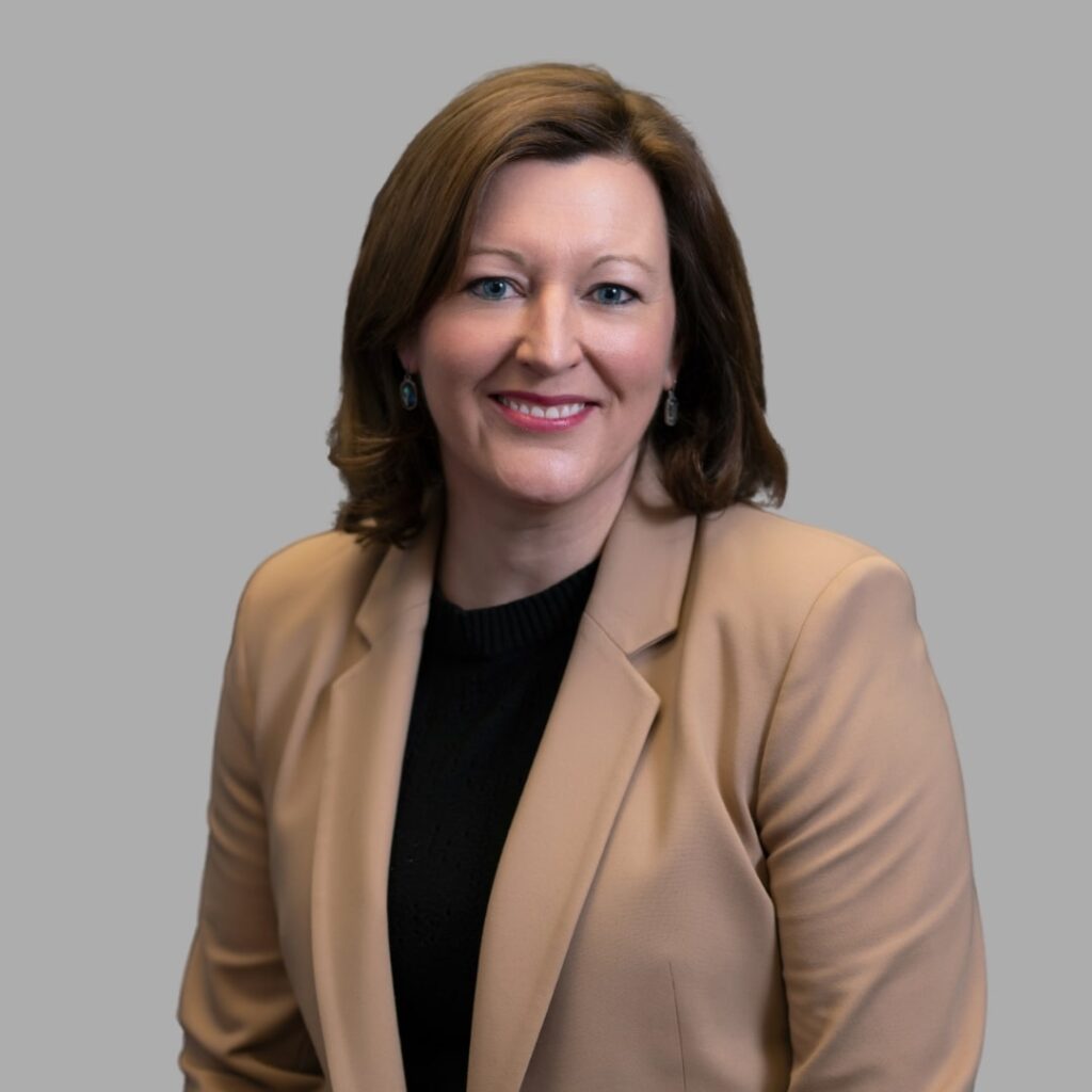 A headshot of a woman smiling